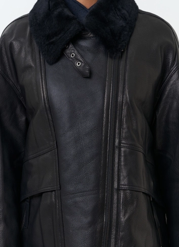 Женский пуховик из натуральной кожи фото